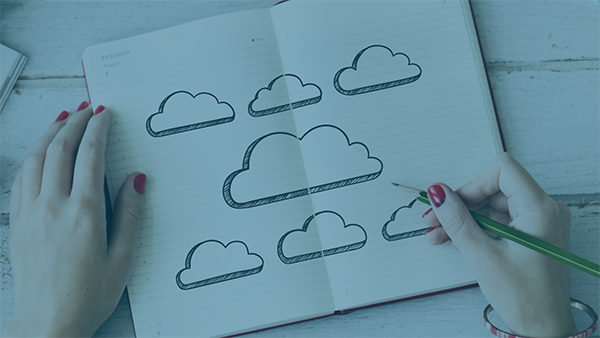  A person draws clouds with a pencil. 